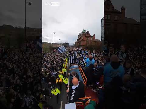 Newcastle team celebrate Carabao Cup victory on bus