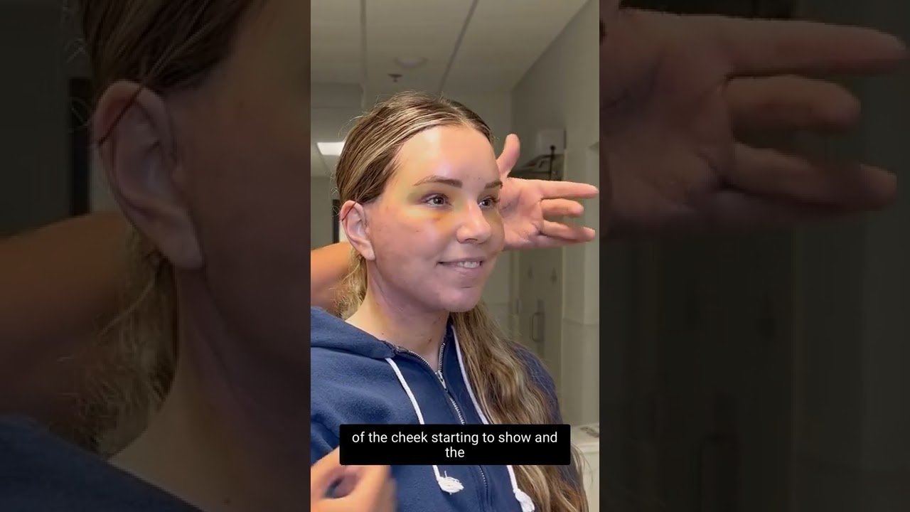 Person smiling during a makeup application process.