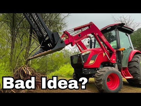 Tree Puller On a Compact Tractor