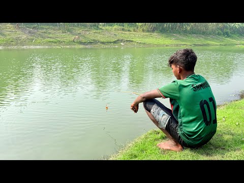 fishing videos || the village boy catching fish by hook in the village river #fishing