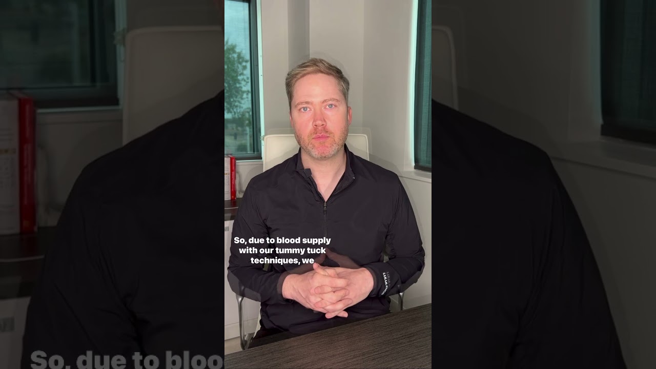 Man discussing tummy tuck techniques and blood supply.