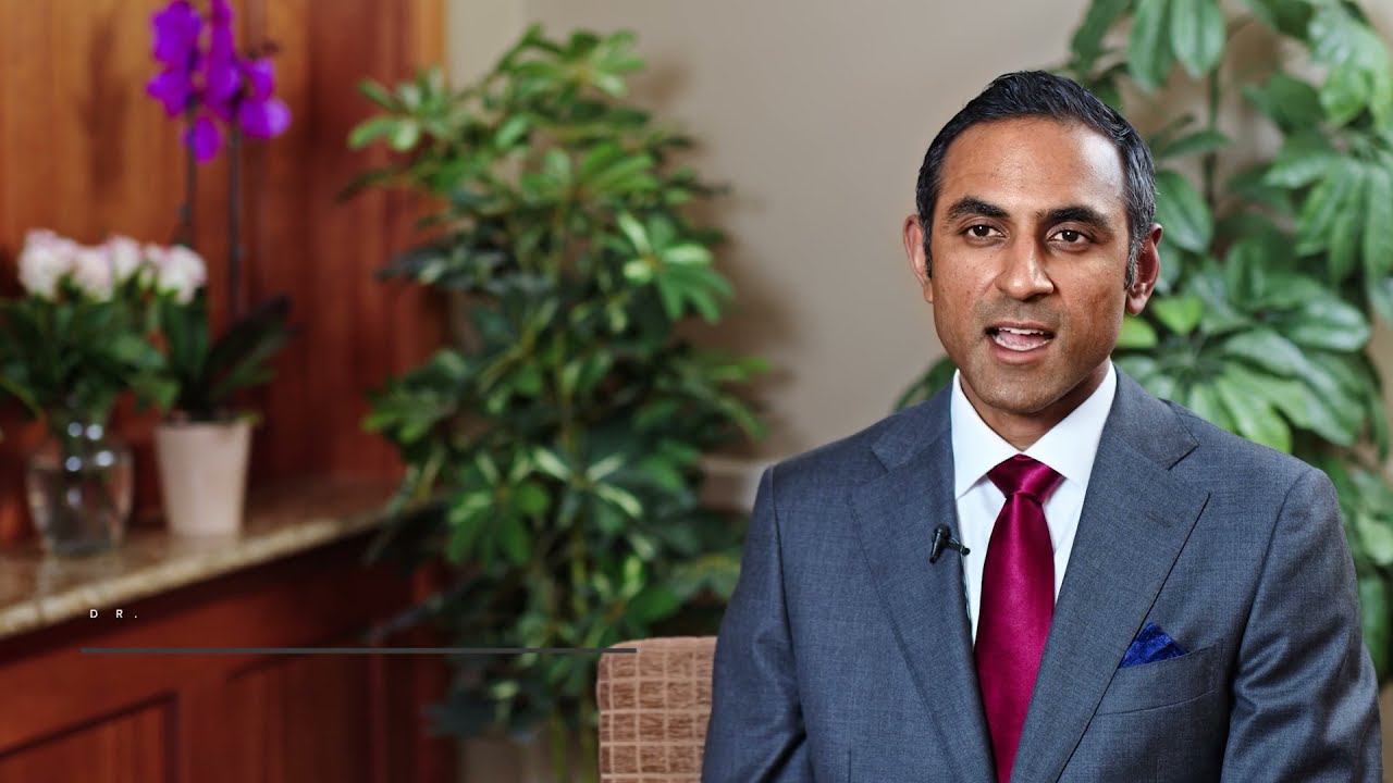 Professional man speaking in a formal setting.