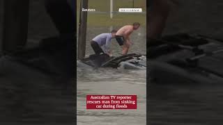 TV reporter and bystander rescue driver moments before car sinks in Australian floodwaters