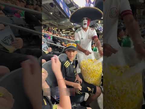 Man give pop corn to boys.