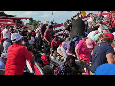 Bloodied Person Carried Away From Stands Following Shooting at Trump Rally