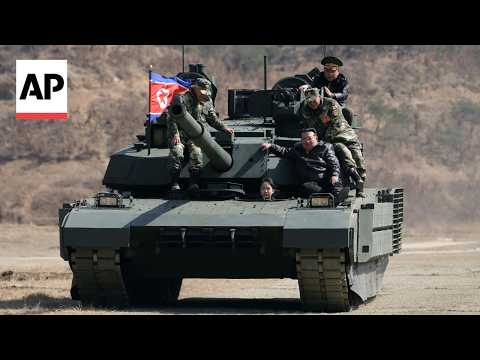 YouTube video thumbnail: North Korean Leader Sits on Tank With his Daughter at Military Exercise