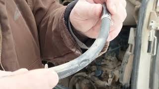 Replacing a fuel line on a excavator 