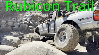 Tacoma's and a jeep run the rubicon trail.