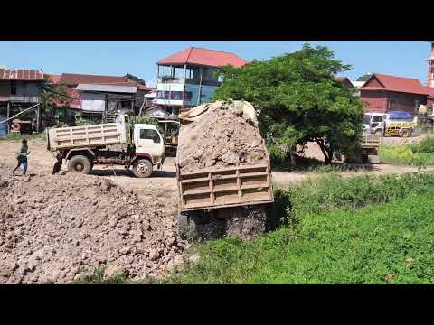 Groundbreaking Work: KOMATSU D20P Bulldozer Pushes Soil with 5-Ton Trucks!