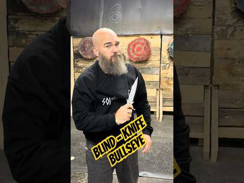 World Champion Knife Thrower hits the bullseye without looking