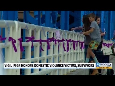 YouTube video thumbnail: Vigil Held in Grand Rapids for Domestic Violence Awareness