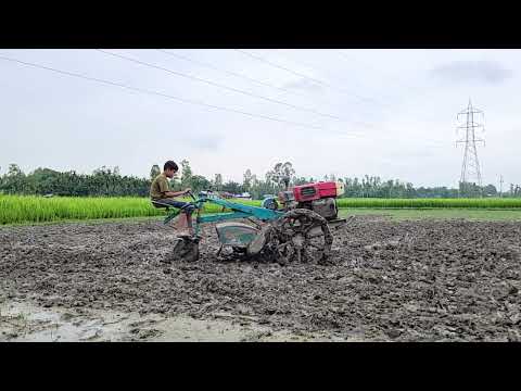 How to work with a power tiller machine in muddy soil ।