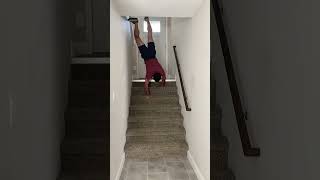 Trying to do a handstand down the stairs.