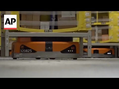 YouTube video thumbnail: Meet the AI Robots Working as Christmas Elves at Amazon