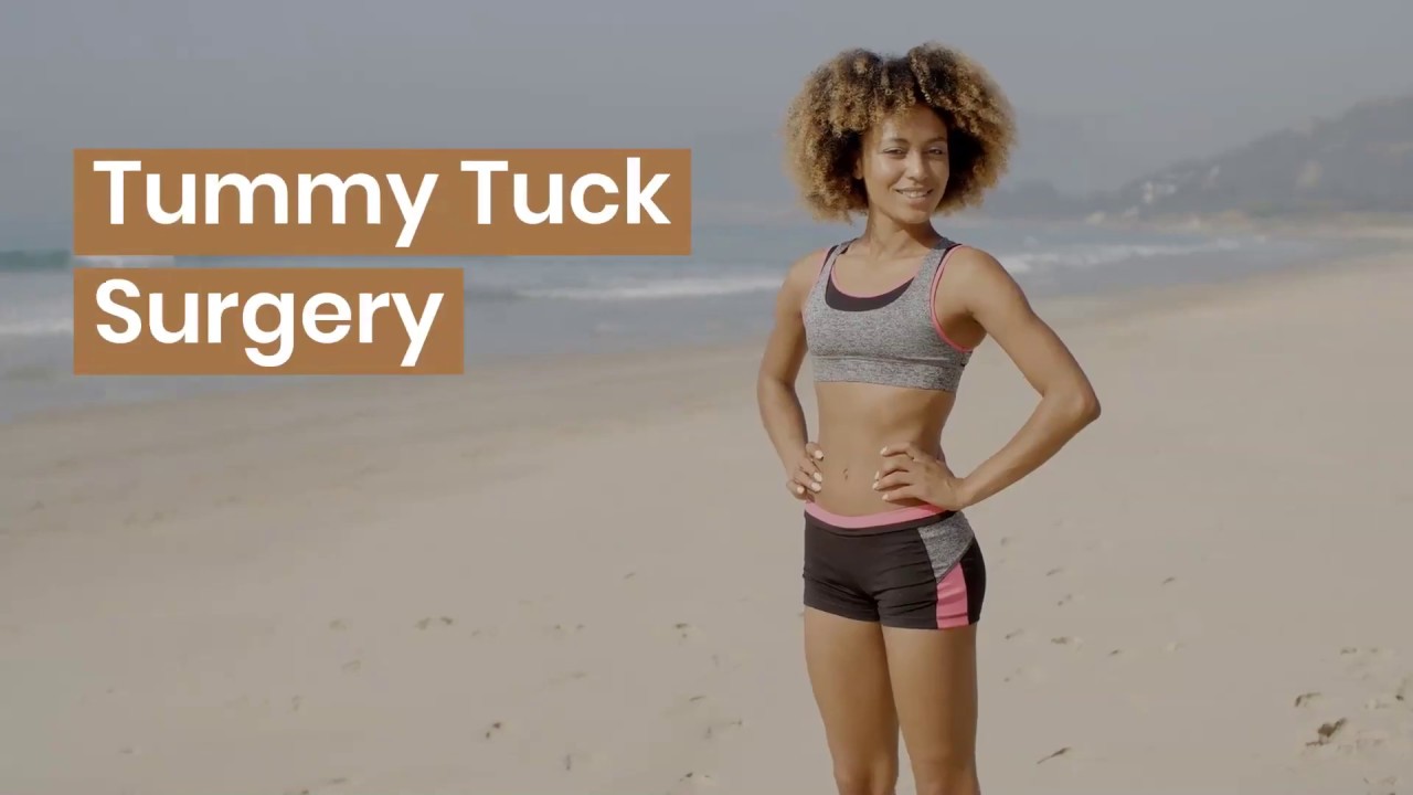 Woman showcasing tummy tuck surgery results on beach.