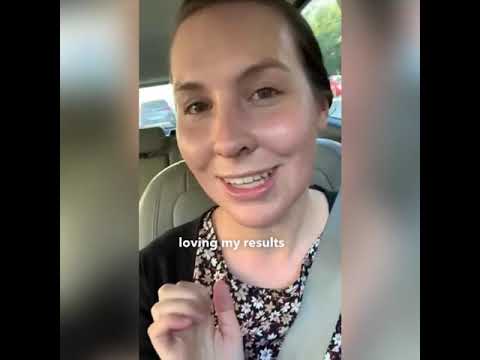 Smiling woman expressing satisfaction with results.
