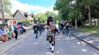 Mace flourish from Drum Major Barclay leading Towie Pipe Band march to 2025 Aboyne Highland Games