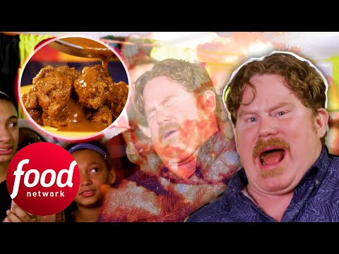 Casey Starts To Lose It While Eating These Jerk Wings Smothered In Ghost Pepper Sauce | Man V Food