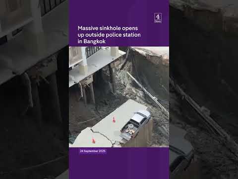 Massive sinkhole opens up outside police station in Bangkok