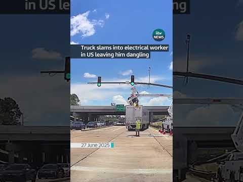 Truck slams into electrical worker in US leaving him dangling #itvnews