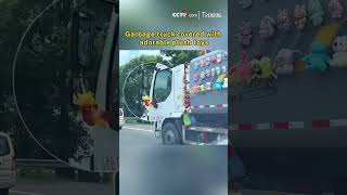 Garbage truck covered with adorable plush toys