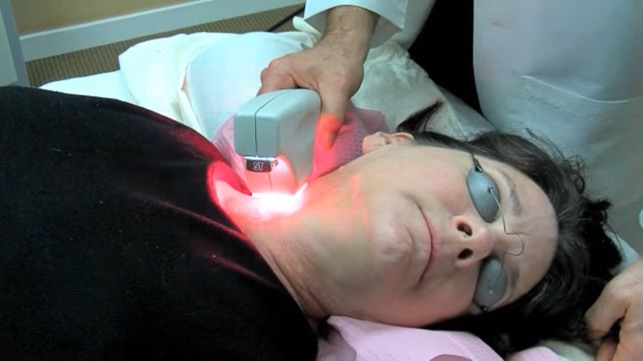 Man speaking on set of Aesthetic TV.