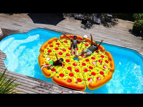 children play with a giant inflatable pizza in Swimming Pool