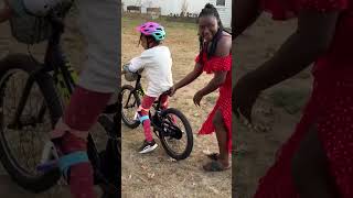 Summer learning to ride her bike she'll be a pro in no time