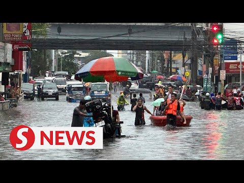 Heavy rains from Typhoon Gaemi render Manila streets underwater