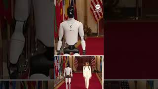 First lady Melania Trump walks with robot during White House technology summit