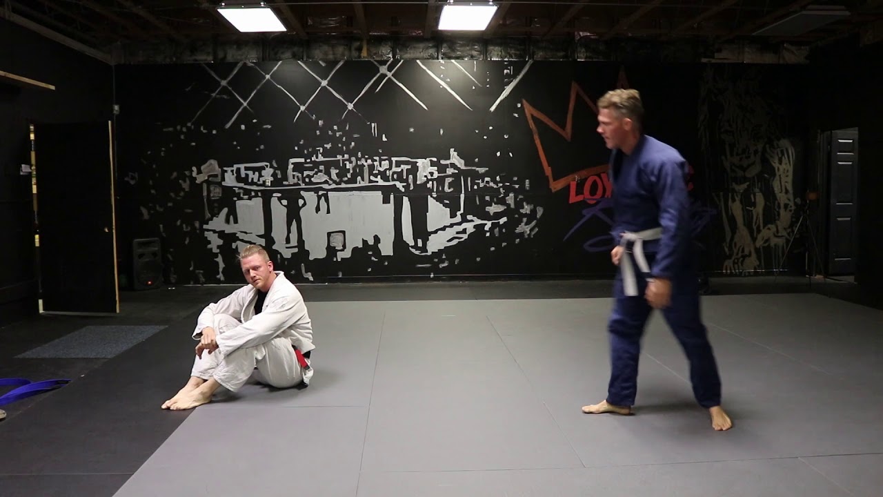 Guillotine defense (sliding down)