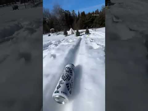 father grabs a cold drink while skating
