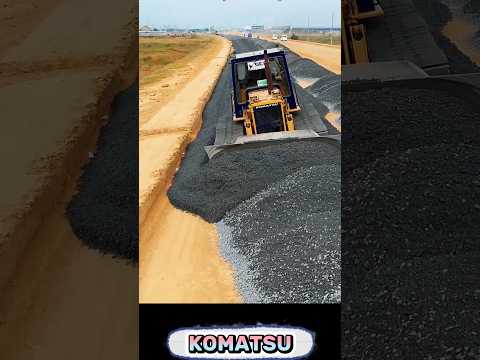KOMATSU D53P: Bulldozer At Work Leveling Gravel Stones for New Roads