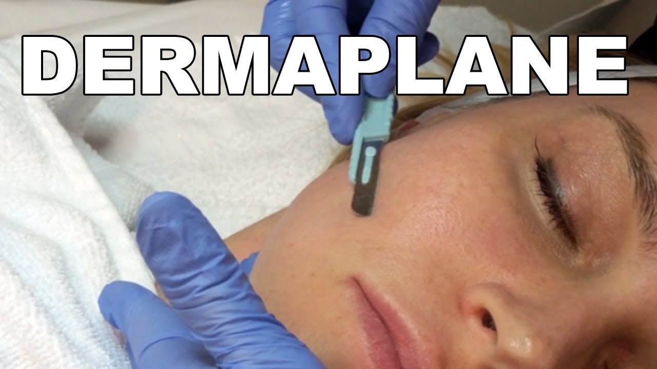 Dermaplaning facial treatment in progress.