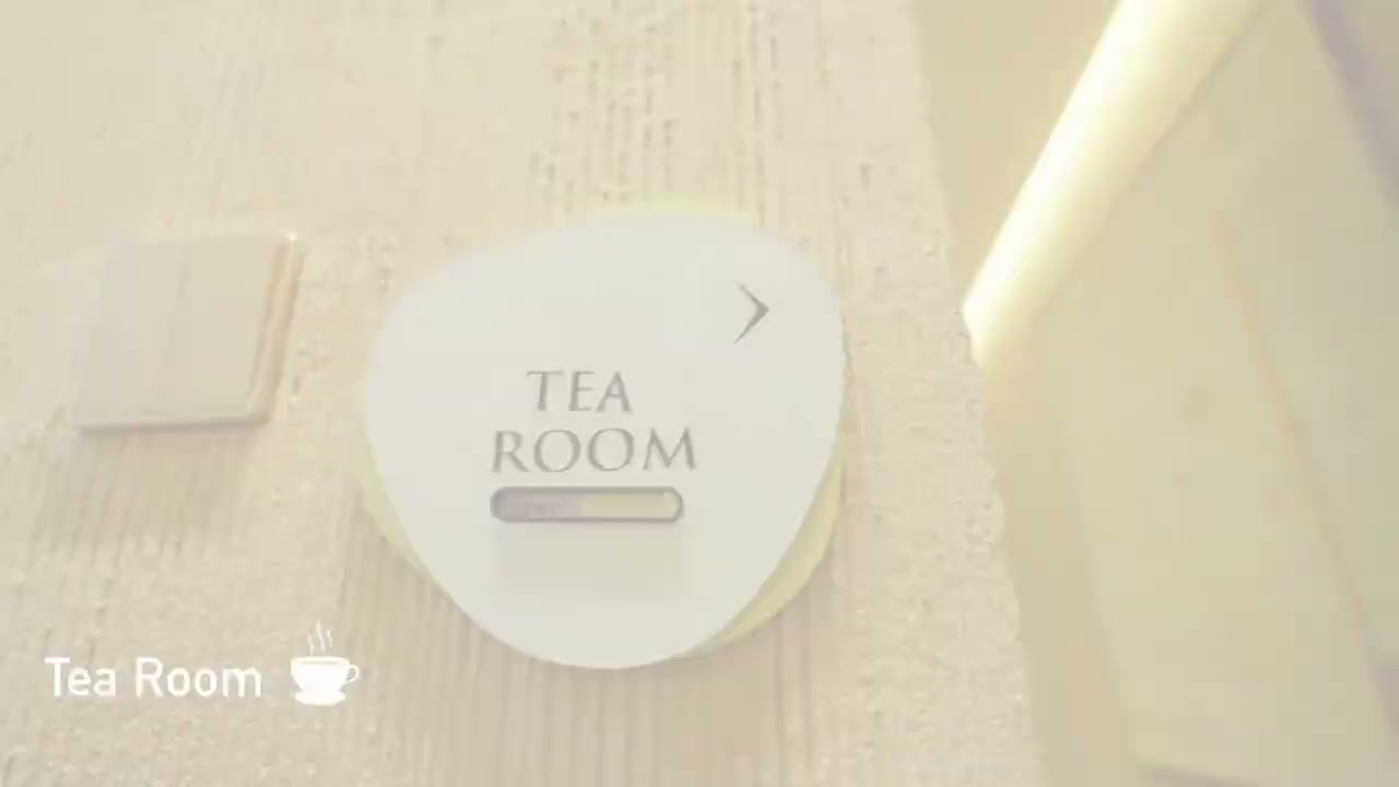 Sign for a tea room on a wall.