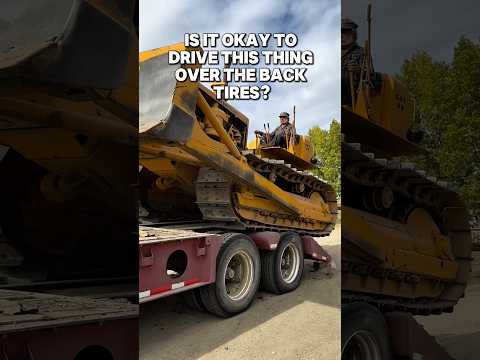 Is it OK to drive this Caterpillar thing over the trailer back wheels #trucking #heavyhauling