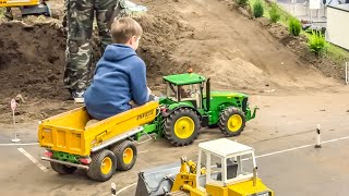 TRACTORS AND RC TRUCKS IN ACTION ON A HUGE PLAYGROUND