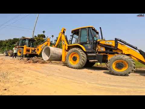 Two JCB 3dx backhoe digging Heavy concreat Hume pipe on Road