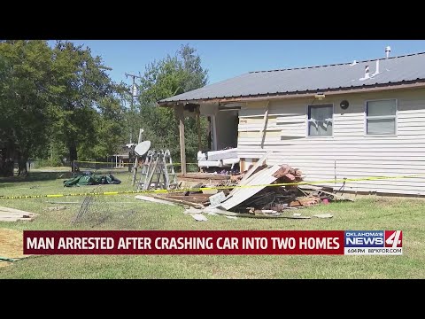 Man arrested after crashing car into two homes