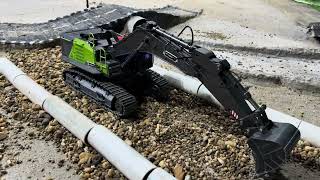 Remote-controlled excavator builds a road!!! The Huina-1593 at a stone quarry.