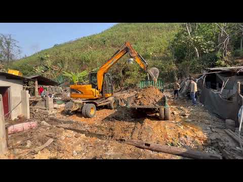 Bulldozer to create flat ground for the house foundation