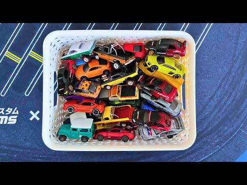 Hot Wheels and Mini GT Cars on Garage Mat from Box Showcase