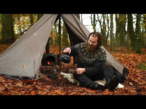 Bushcraft trip - rainy day in a hot tent next to large lake, making firewood and cooking a meal etc.