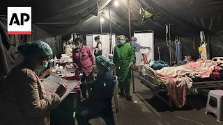 YouTube video thumbnail: Patients Are Treated in Makeshift Tents Outside a Hospital After Indonesia Earthquake