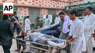 YouTube video thumbnail: Injured are Brought to a Hospital in Pakistan After Suicide Bombing Kills 12