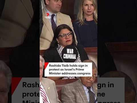 Rawhide Tlaib holds sign in protest as Israel’s Prime Minister addresses congress