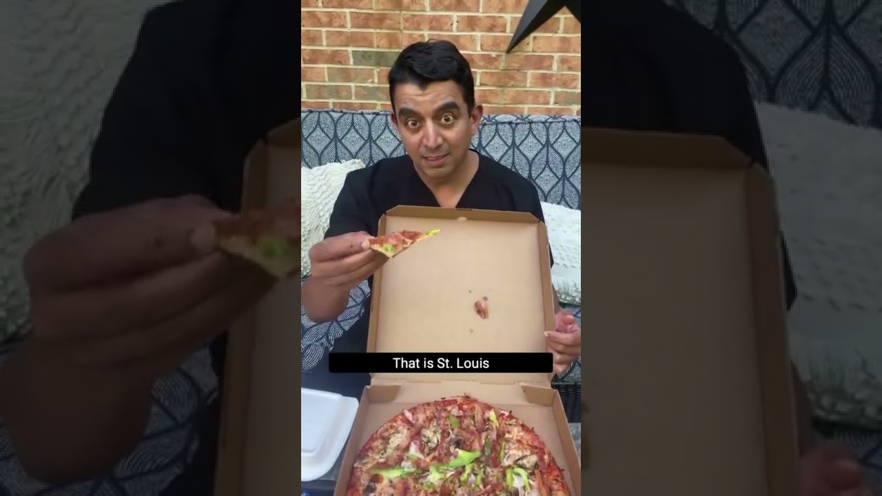 Man surprised by St. Louis-style pizza slice.