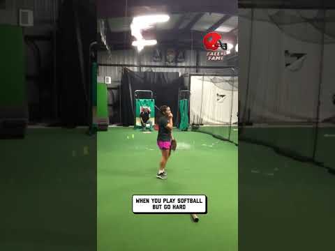 Girl Playing Softball Breaks Light