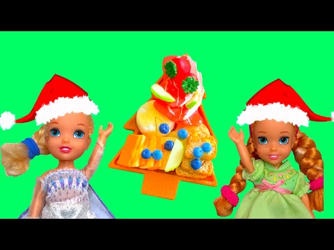 Elsa and Anna toddlers  make a charcuterie board for Christmas