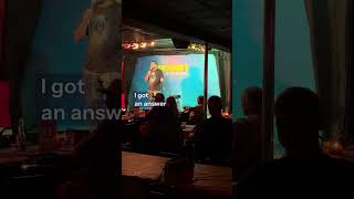 Hugh Murray IV with a heckler at McGuire’s Comedy Club